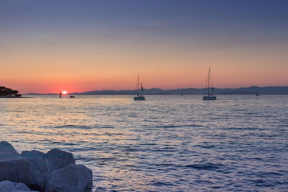 Dalmatian coast blue hour with sailboats at sea.jpg
